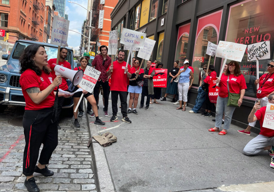 Scholastic workers rally outside headquarters in August 2023.