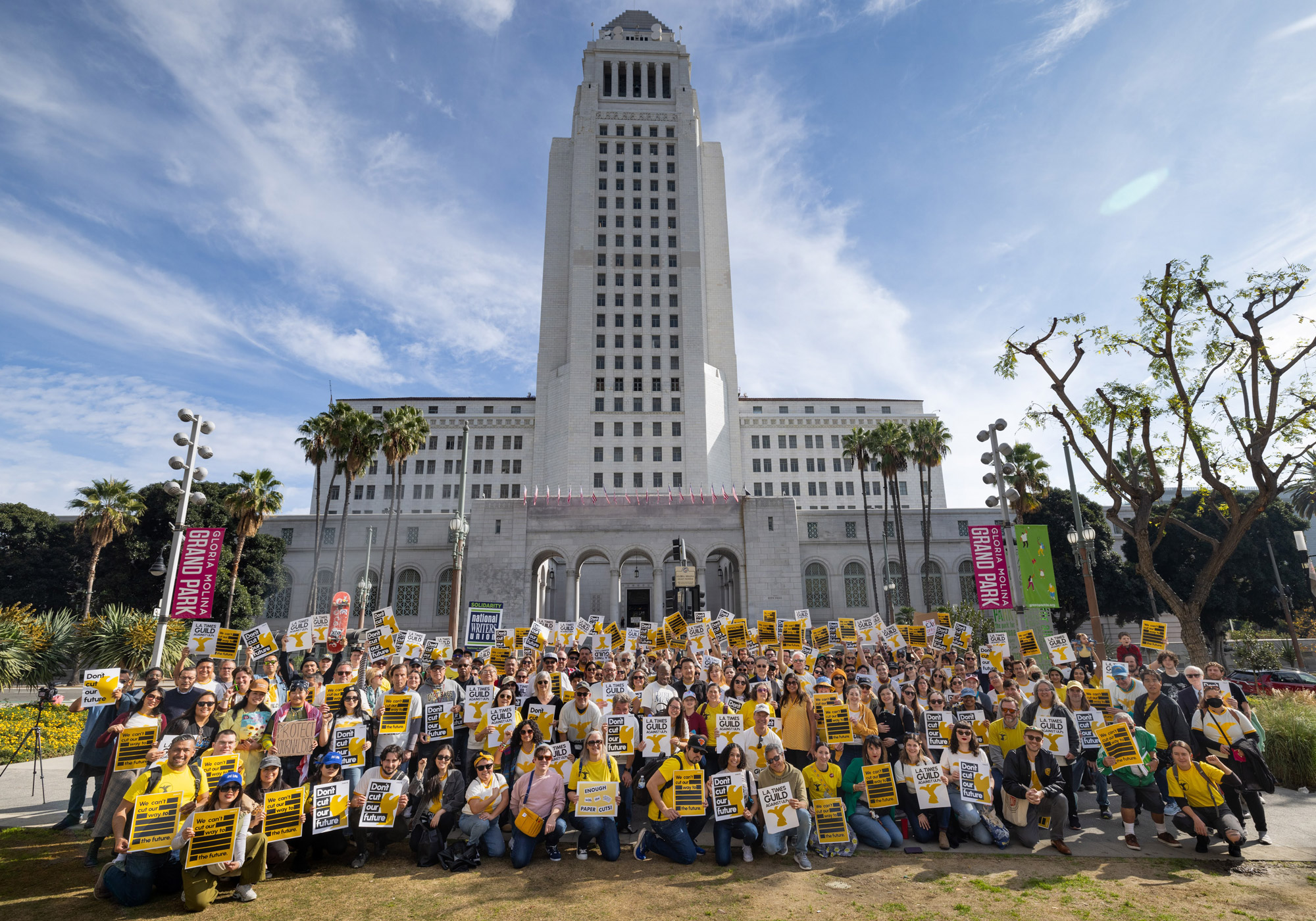 Photo of Los Angeles Times staffers posing in front of Los Angeles City Hall on January 19, 2024 during a strike (Jay L. Clendenin)