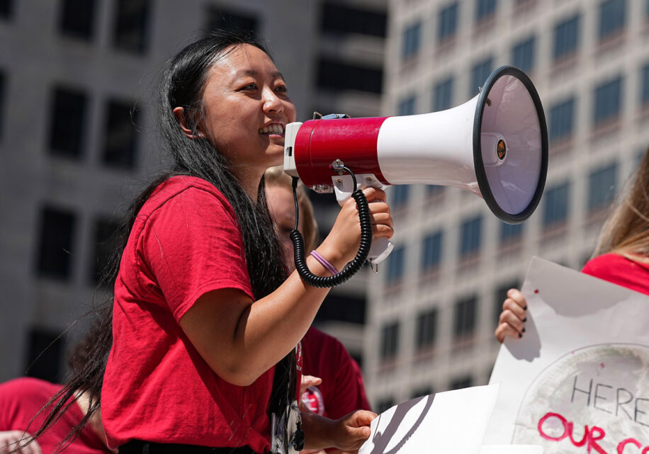 Binghui Huang speaking to supporters and members of the Indianapolis NewsGuild during a rally in 2022