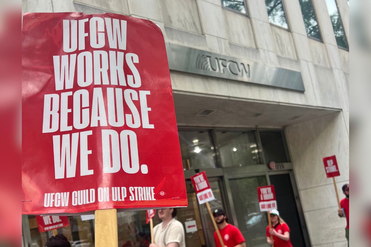 "UFCW works because we do" sign held during strike.