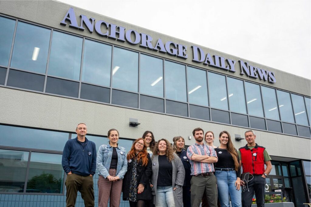 Anchorage News Guild Members standing outside of Anchorage Daily News