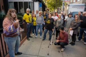 Pittsburgh Post-Gazette striker Natalie Duleba calls on PG owners to end the two-year labor dispute during a rally at the newspaper's North Shore newsroom on Tuesday, Oct. 8, 2024. The rally marked the two-year anniversary of the strike. (Steve Mellon/Pittsburgh Union Progress)