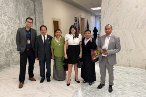 Radio Free Asia Guild members pose for a photo with Representative Hayley Stevens on Capitol Hill while advocating for continued funding of the news service.