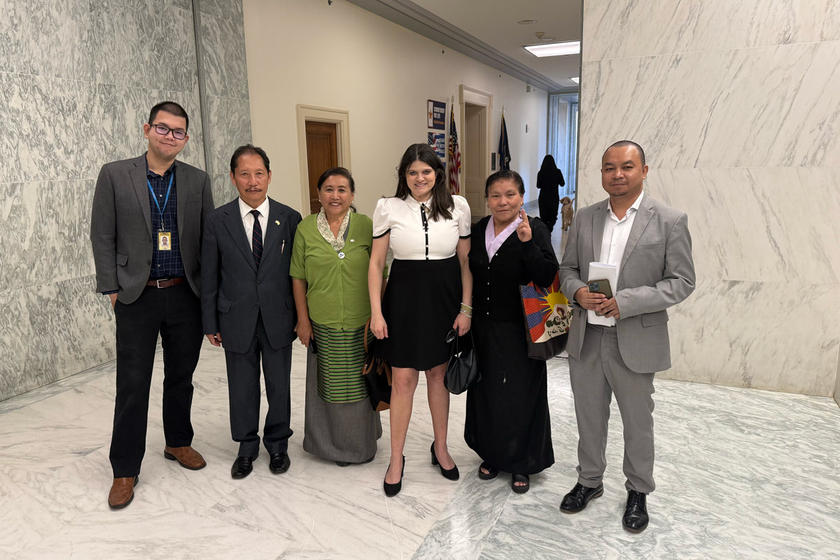 Radio Free Asia Guild members pose for a photo with Representative Hayley Stevens on Capitol Hill while advocating for continued funding of the news service.