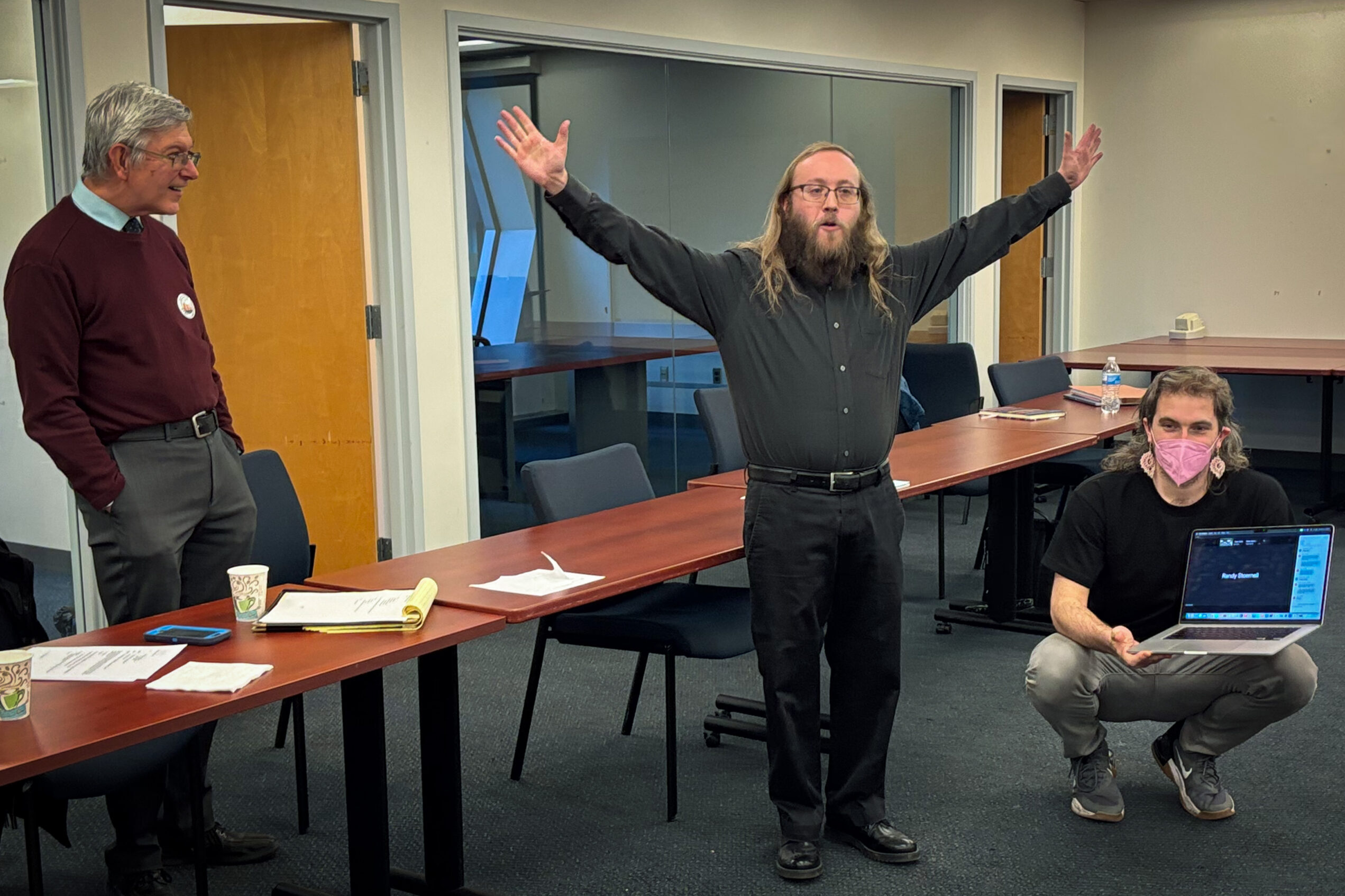Andrew Goldstein, president of the Newspaper Guild of Pittsburgh, announces the end of the union's strike against the Pittsburgh Post-Gazette after a member vote on Thursday, Nov. 13, 2025. At left is guild officer and transportation reporter Ed Blazina. At right is Newsguild-CWA organizer Jacob Klinger. (Steve Mellon/Pittsburgh Union Progress)