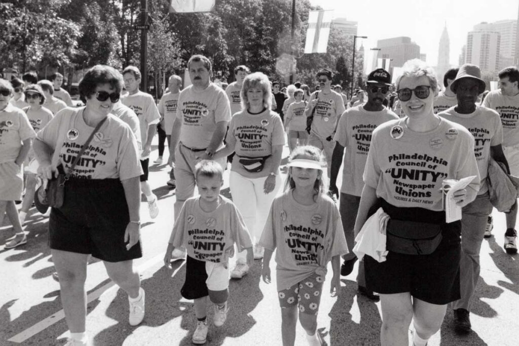 Photo of people including Carol Rothman at a labor day parade